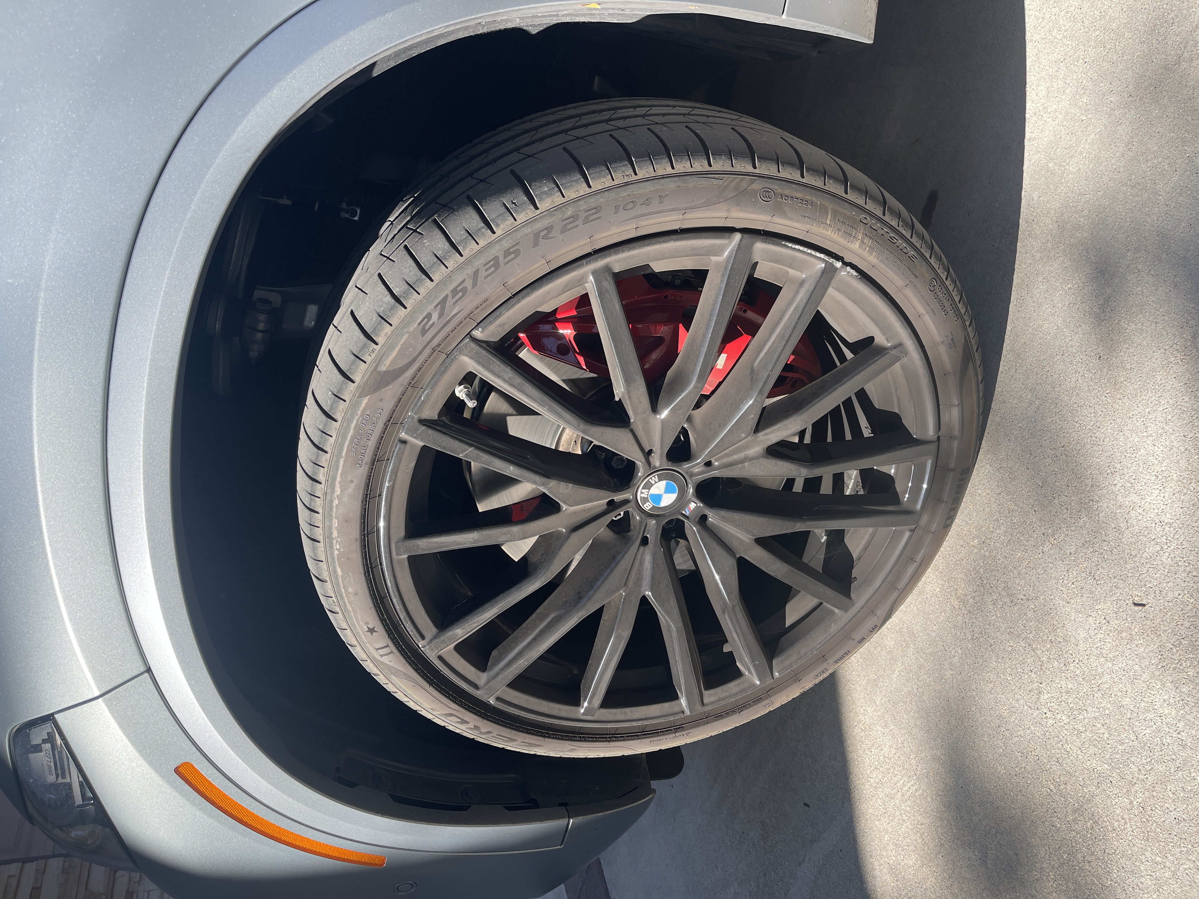BMW wheel before paint correction - swirl marks and contamination visible